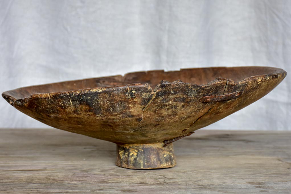 Antique primitive raised wooden bowl