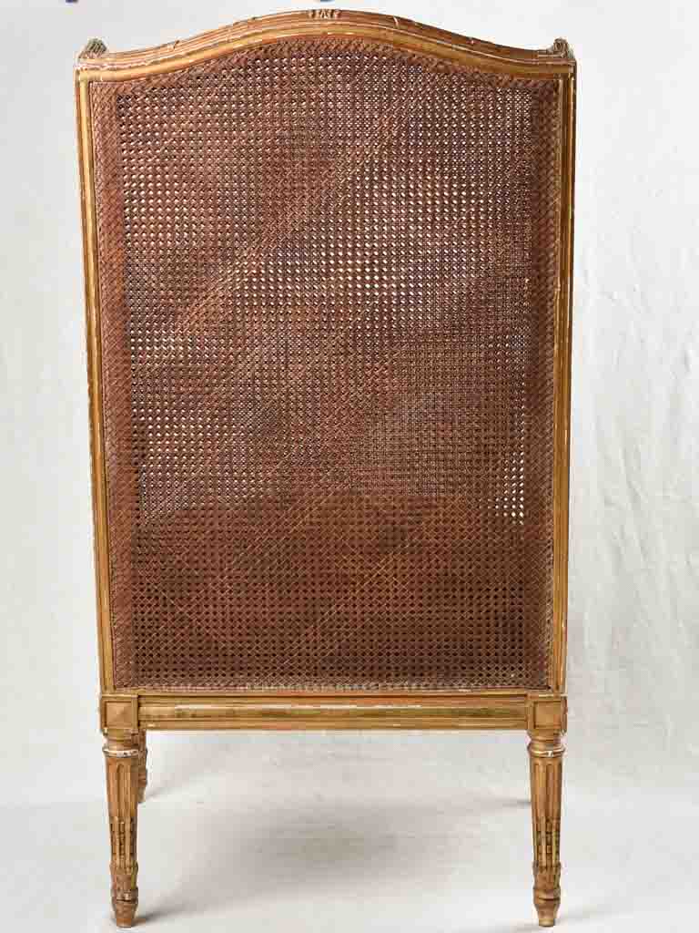Large cane bergere armchair - ram's heads - 19th century