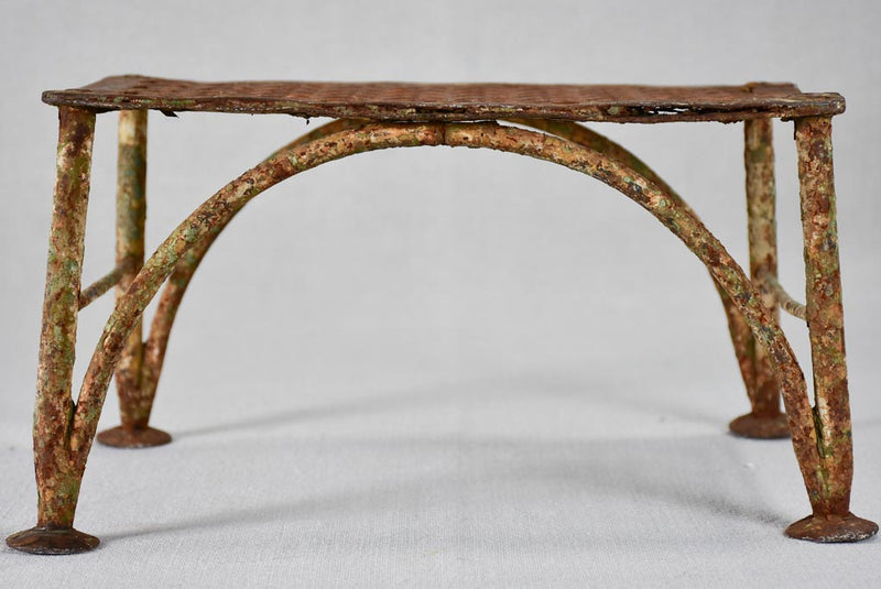 Early-20th-century wrought iron garden foot rest