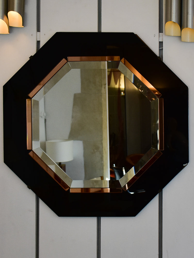Octagonal mirror with black and pink glass frame
