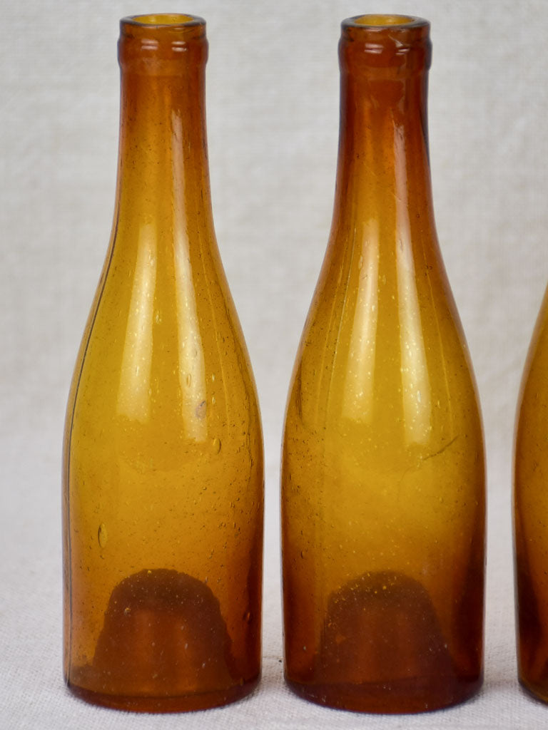 Set of six amber glass miniature bottles from the 19th century 6¼"