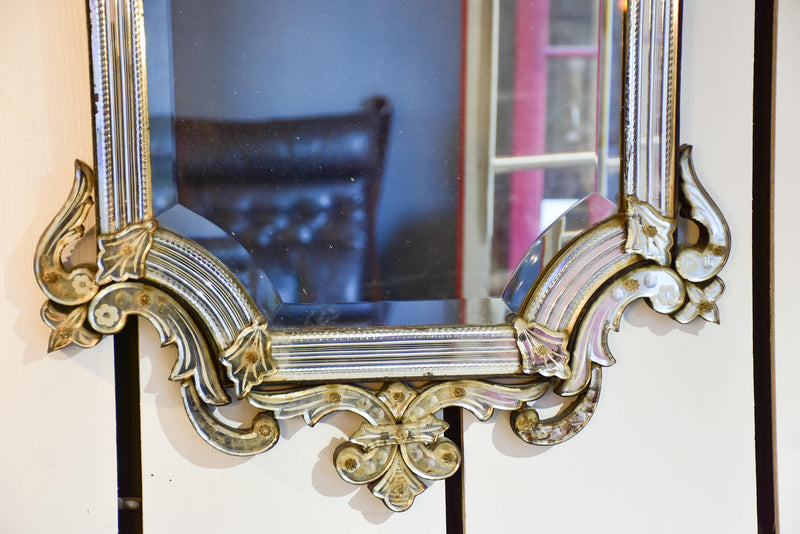Antique Venetian mirror with decorative frame