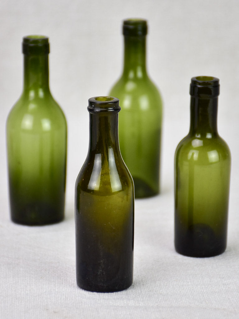 Collection of four miniature blown glass wine bottles from the 19th century 4¼"