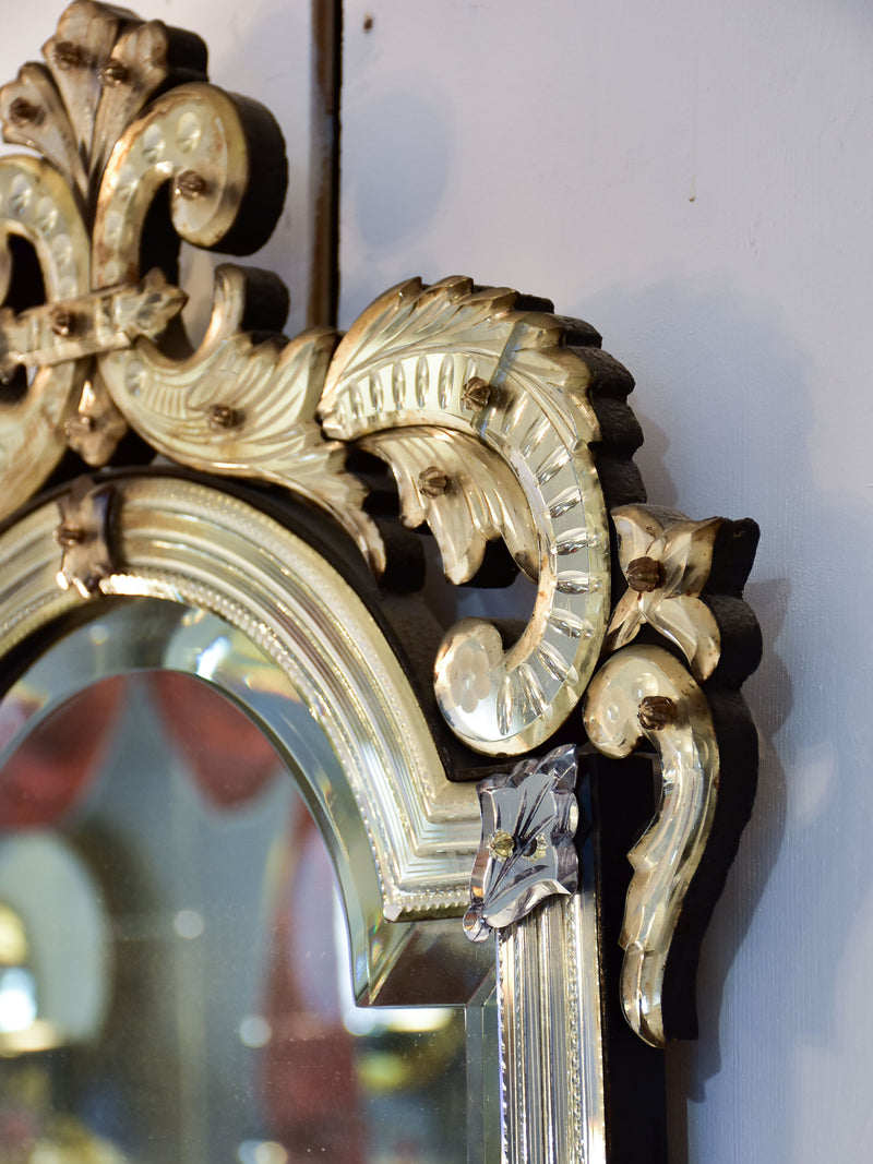 Antique Venetian mirror with decorative frame