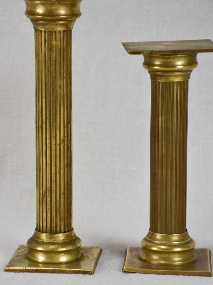 Aged square-top brass pedestals