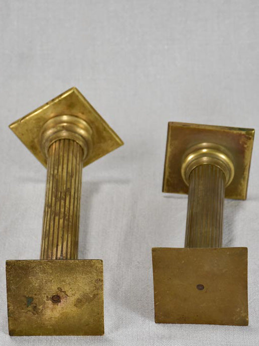 Angle-topped brass display pedestals