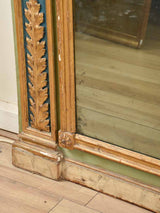Gilded adornments on trumeau mirror