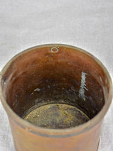 Rusty old French measuring cup