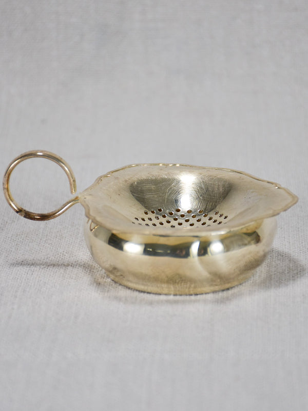 Vintage English silver-plated tea strainer