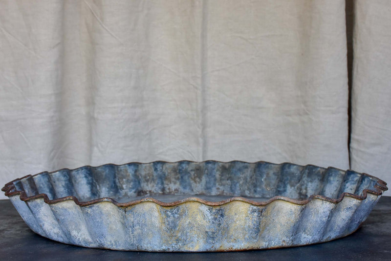 Five large antique French zinc dishes with rippled edge for harvesting resin