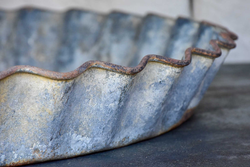 Five large antique French zinc dishes with rippled edge for harvesting resin