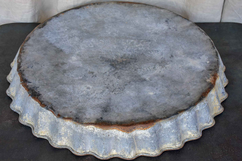 Five large antique French zinc dishes with rippled edge for harvesting resin