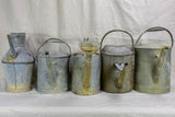 Collection of five antique zinc watering cans
