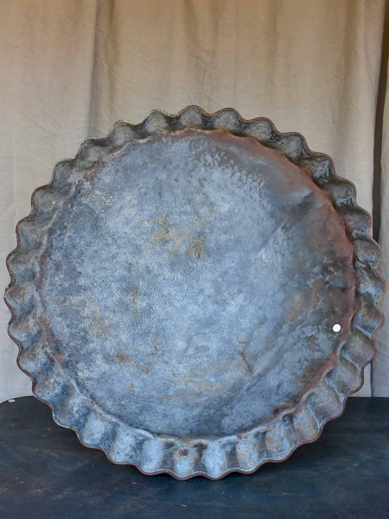 Five large antique French zinc dishes with rippled edge for harvesting resin
