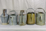 Collection of five antique zinc watering cans