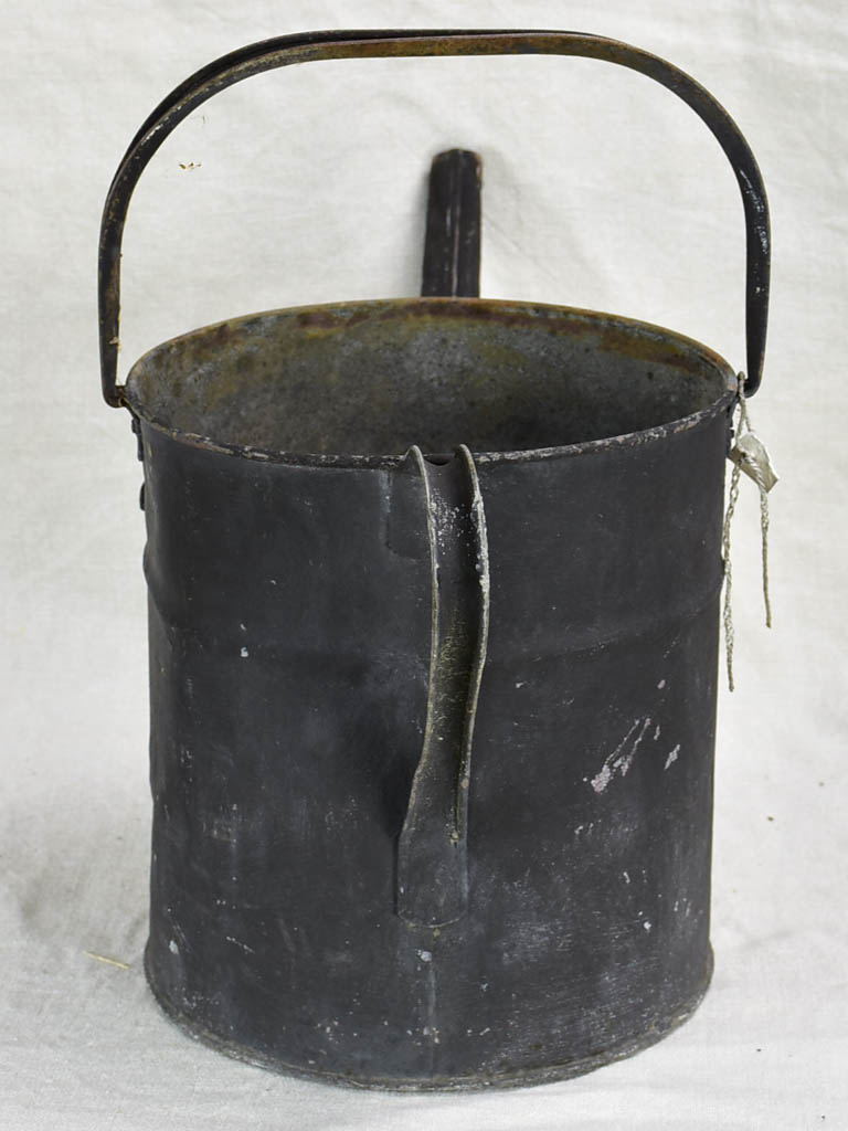 Antique English watering can with black painted finish