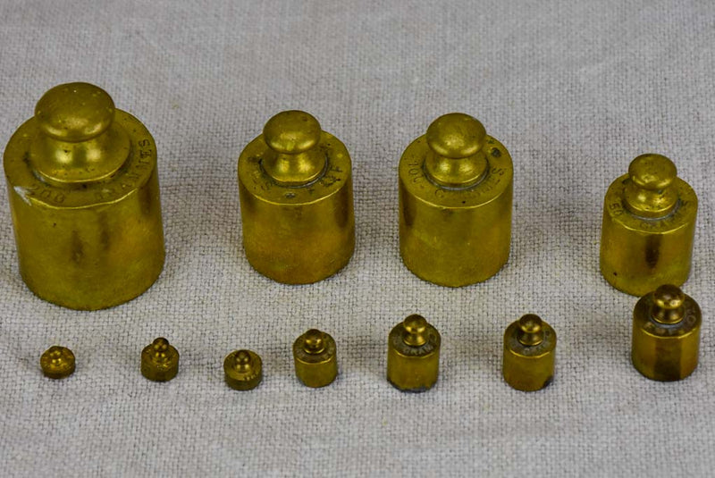Set of eleven antique French weights for scales - 1-200g