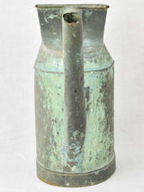 Antique French watering can with verdigris patina