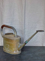 Antique French watering can with long spout