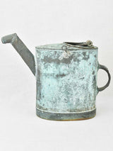 Antique French watering can with blue green atina