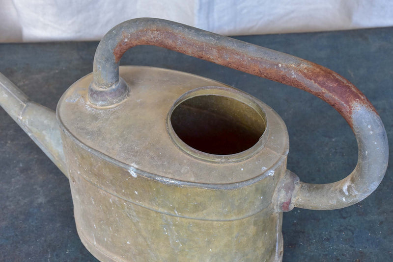 Antique French watering can with long spout