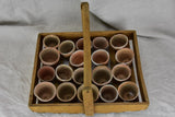 Antique French wooden potato harvest basket with terracotta pots