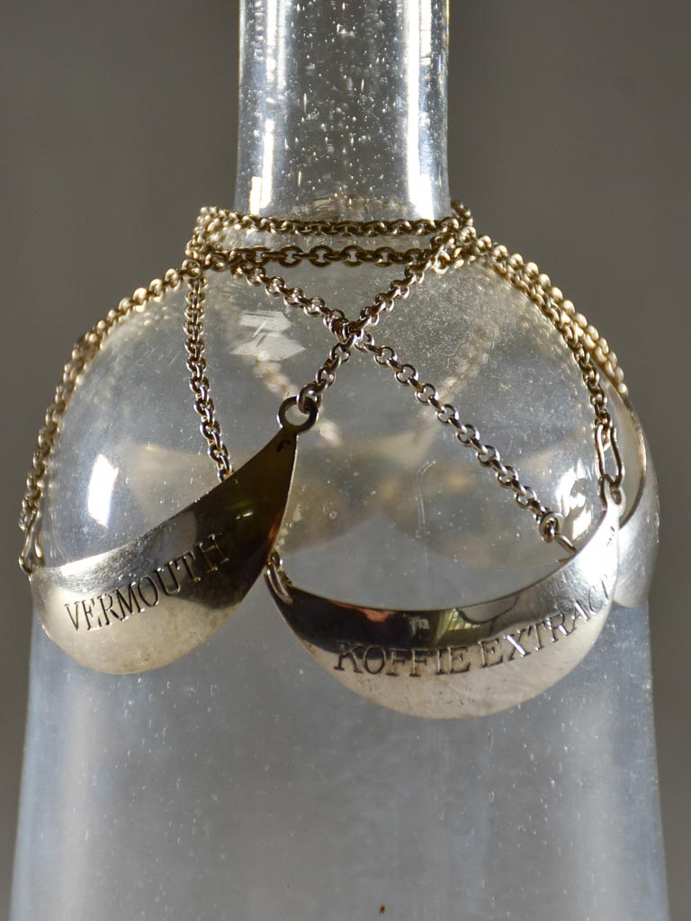 Collection of vintage silver plate liqueur labels