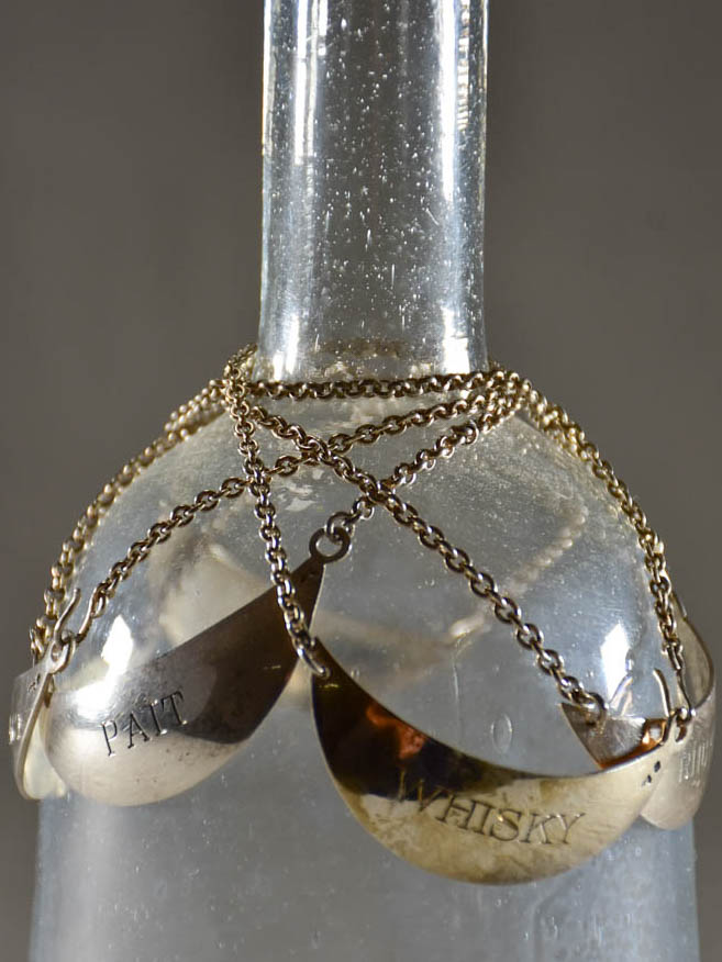 Collection of vintage silver plate liqueur labels