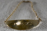 Collection of vintage silver plate liqueur labels