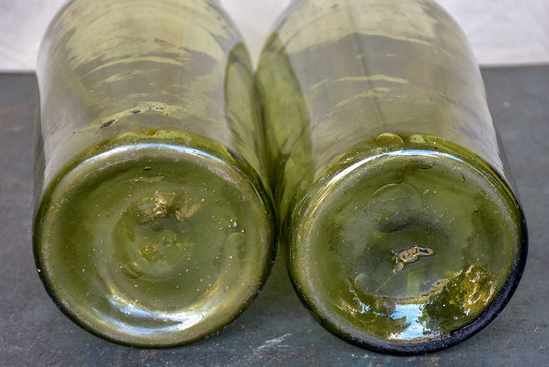 A pair of large late 19th Century green glass jars