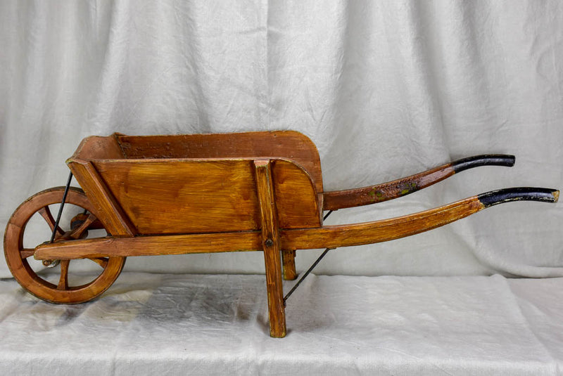 Antique French wooden wheelbarrow