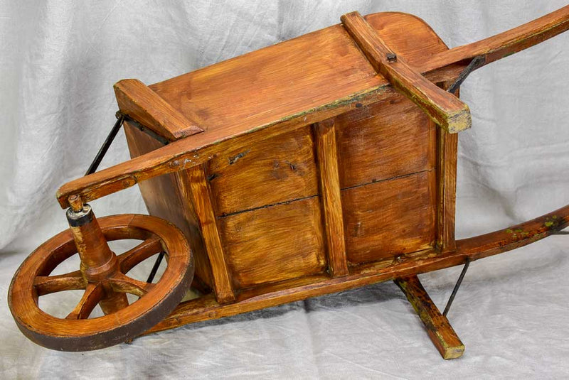Antique French wooden wheelbarrow