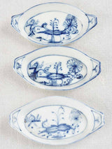 5 blue and white oval bowls