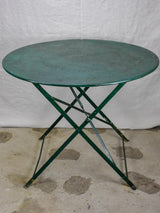 Round antique French folding garden table with green paint finish