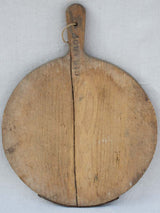 Early 20th century round cutting board branded Girard F. 20½" x 15¼"