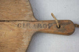 Early 20th century round cutting board branded Girard F. 20½" x 15¼"