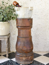 Marble mortar with double headed pestle in carved timber stand