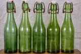 17 antique French lemonade bottles with ceramic stoppers