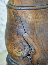 Marble mortar with double headed pestle in carved timber stand