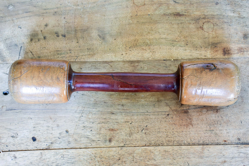 Marble mortar with double headed pestle in carved timber stand