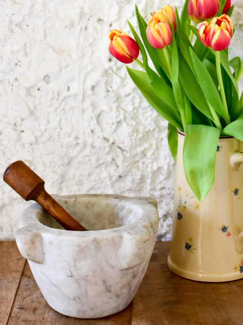 Small marble mortar with double headed pestle
