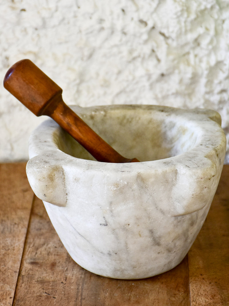 Small marble mortar with double headed pestle