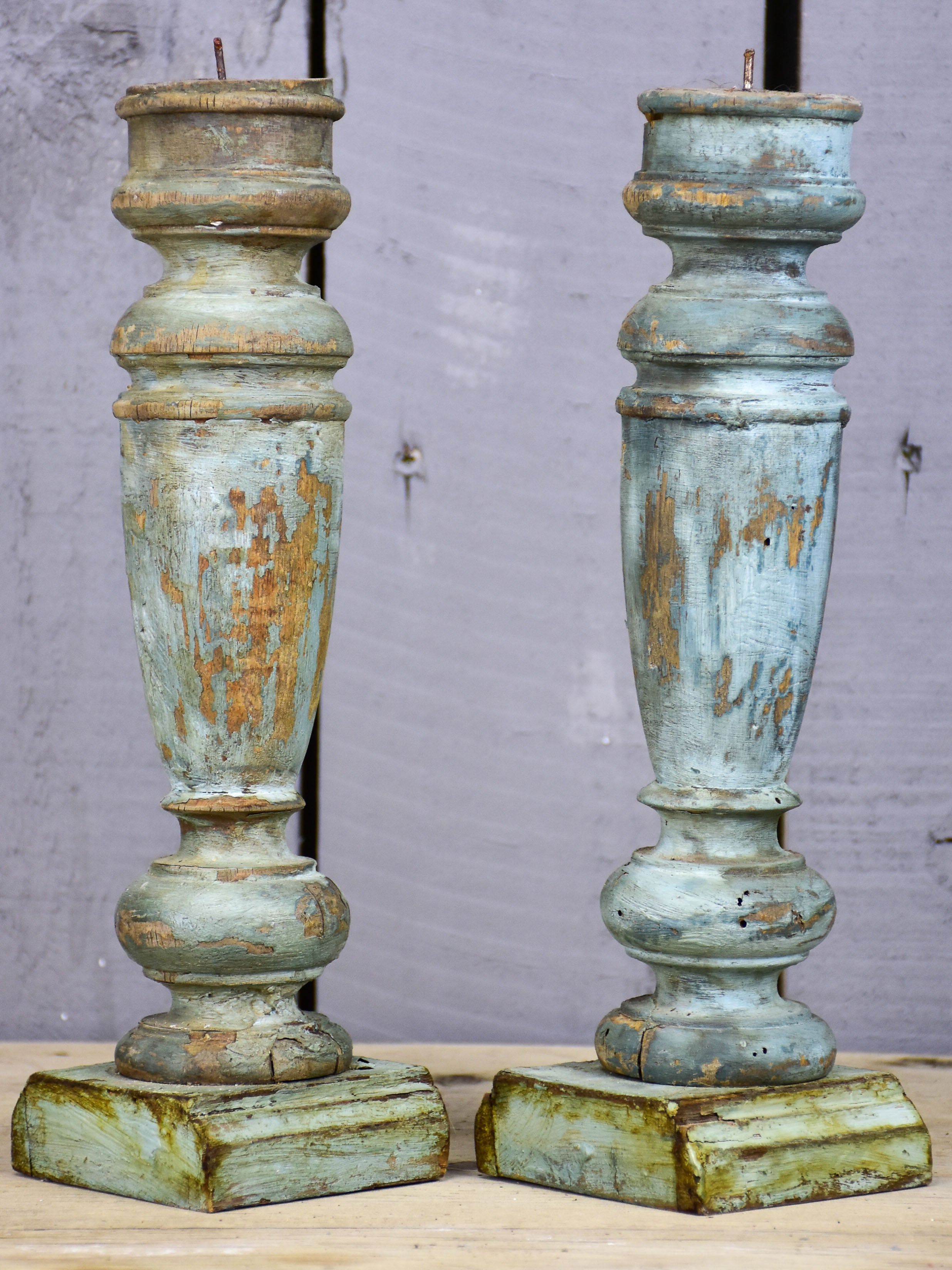 Pair of artisan-made French candlesticks with salvaged materials