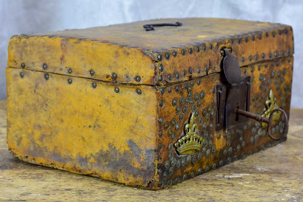 17th Century leather and wooden storage chest with key