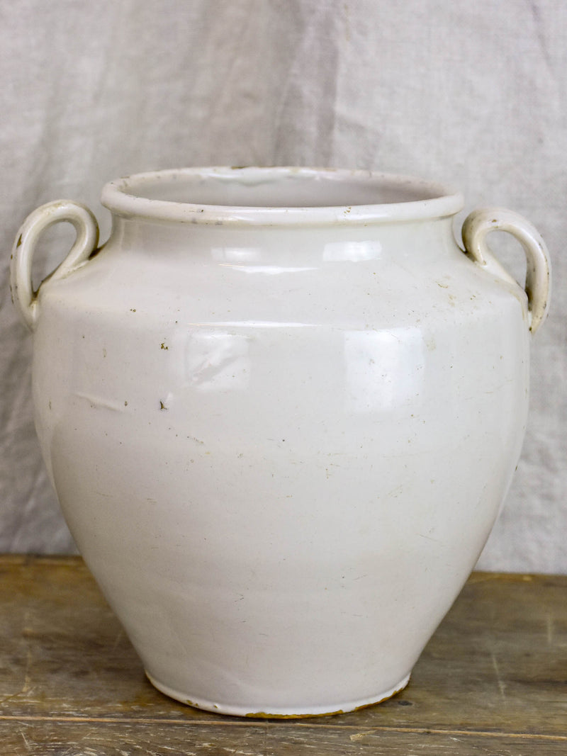 Antique earthenware preserving pot with white glaze