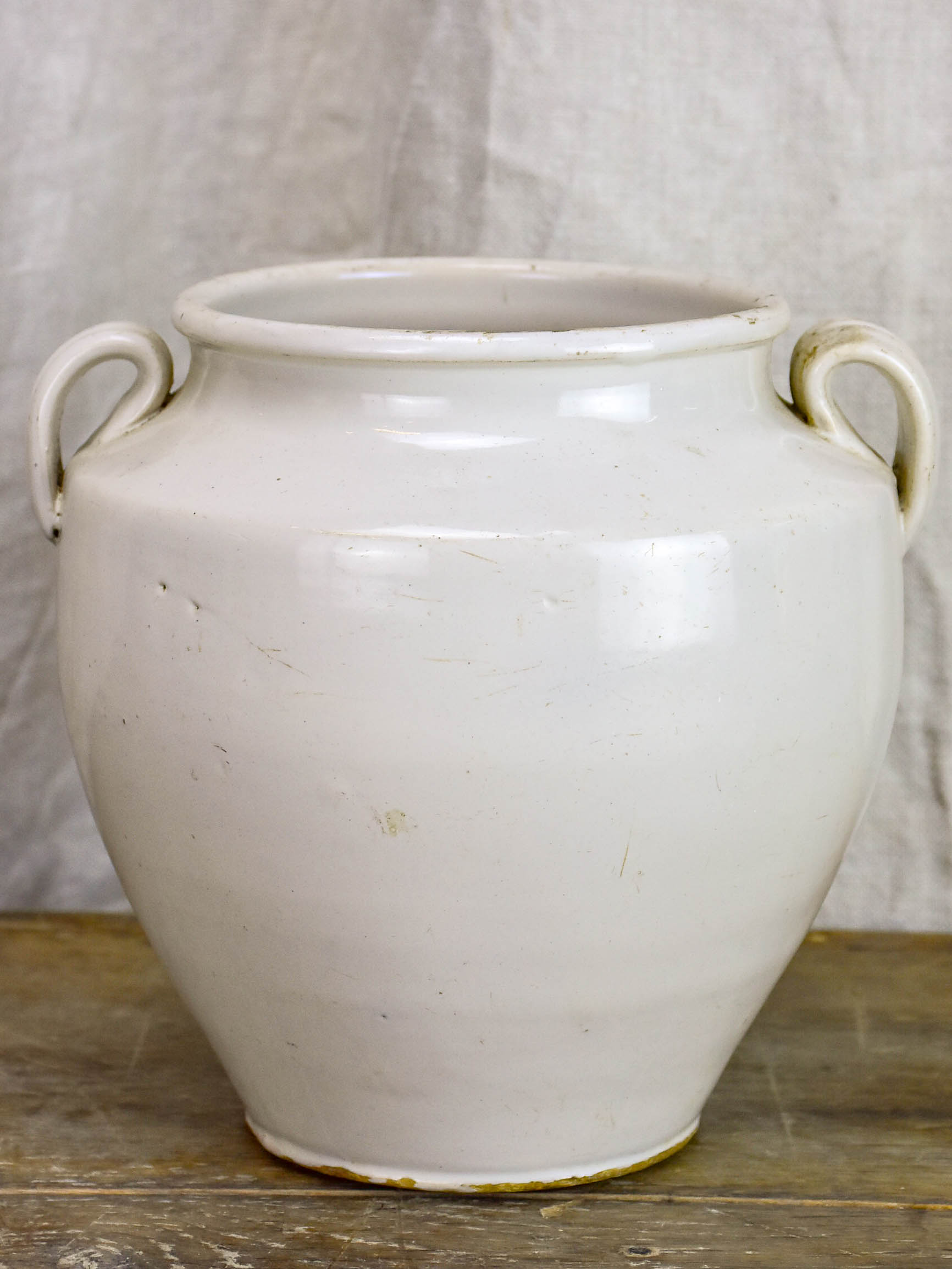 Antique earthenware preserving pot with white glaze