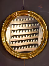 Round vintage French mirror with gold brass frame