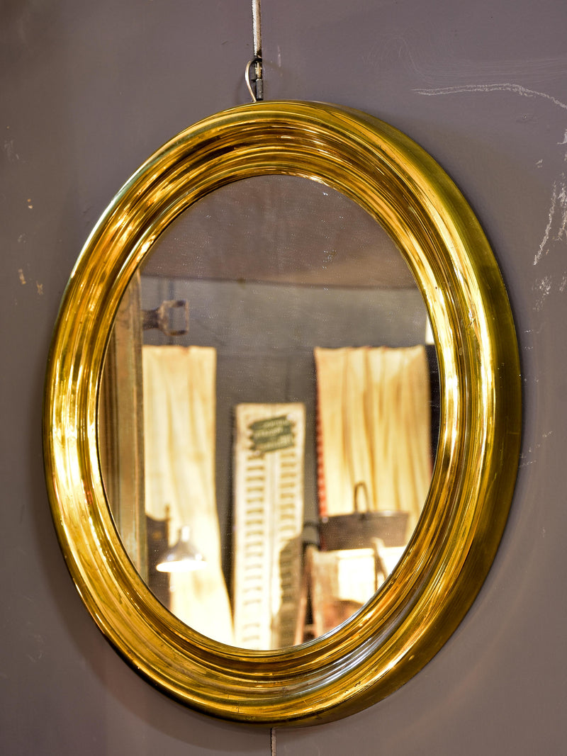 Round vintage French mirror with gold brass frame
