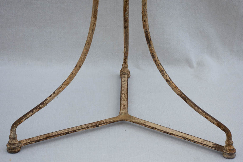 Early 20th century French garden table with ochre patina