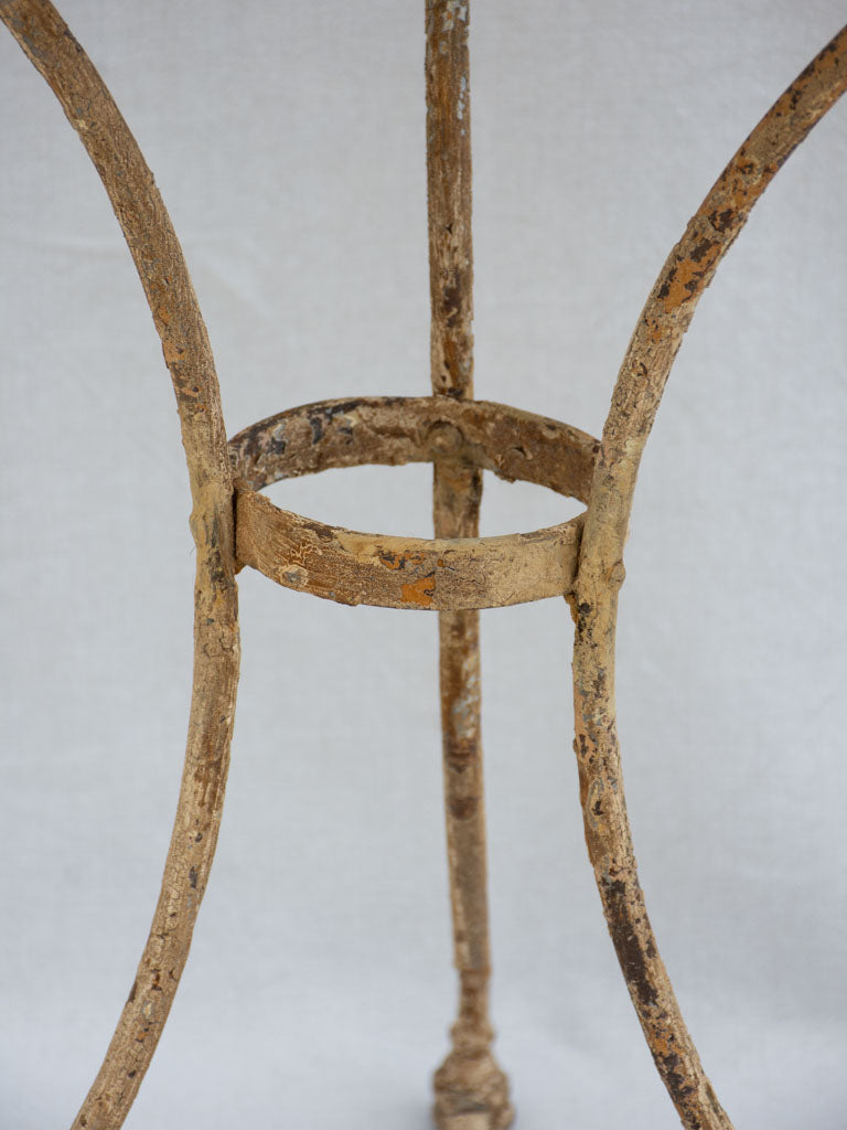 Early 20th century French garden table with ochre patina